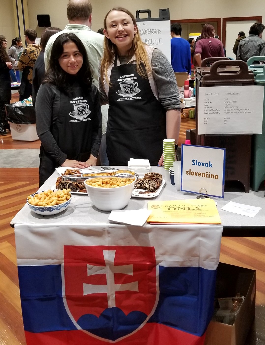 Students serving coffee and snacks